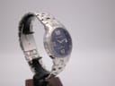 Side-angled view of the Gianni Sabatini watch, highlighting the brushed stainless steel case and bracelet links.