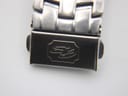 Close-up of the stainless steel bracelet clasp, clearly showing the engraved Gianni Sabatini logo.