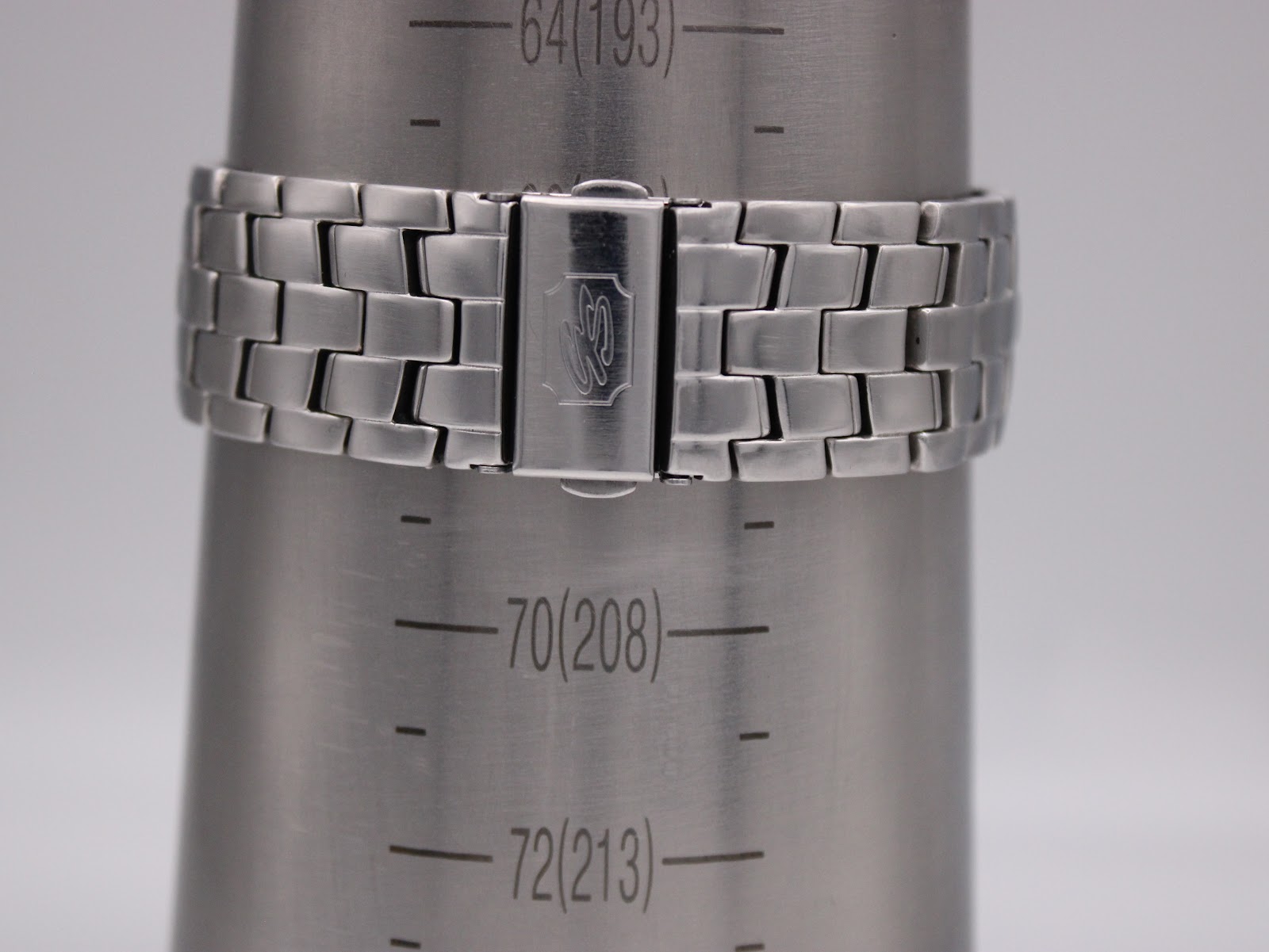 Watch bracelet on a wrist sizing cone, indicating a wrist circumference of approximately 190mm (7.5 inches).