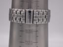 Watch bracelet on a wrist sizing cone, indicating a wrist circumference of approximately 190mm (7.5 inches).