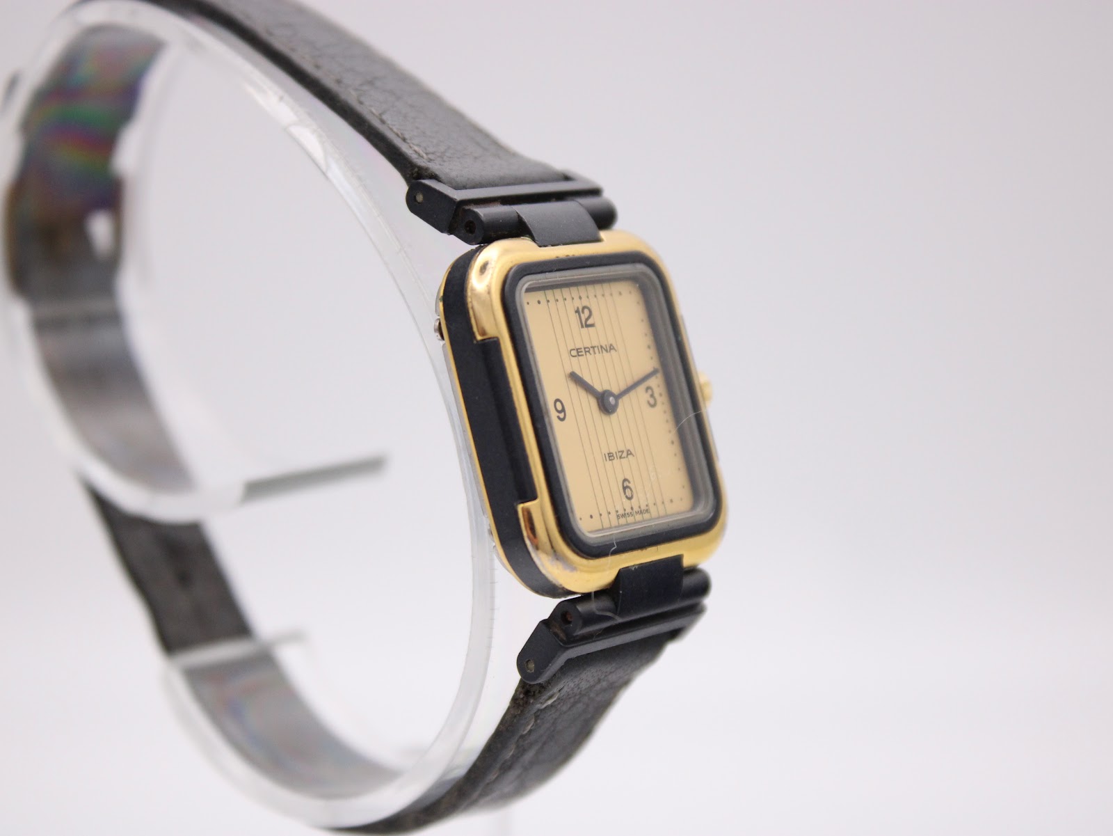 Opposite angled side view of the Certina Ibiza watch on a stand, showing the case profile