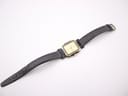 Full overhead view of the Certina Ibiza watch and black leather strap laid flat against a white background