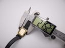 Close-up of a digital caliper measuring the width of the Certina Ibiza watch case, displaying 21.52mm