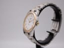 Another angled side view of the Tissot PR 50 watch on a stand, highlighting the case profile.