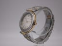 Angled view of the Michel Herbelin Newport watch on a clear display stand, showing the two-tone case and bracelet.