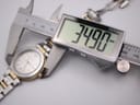 Digital caliper measuring the Michel Herbelin watch case diameter precisely at 34.90mm.
