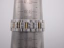 Watch bracelet on a sizing cone, showing a wrist circumference measurement of approximately 150mm (15cm).