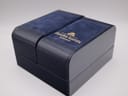 Exterior view of the navy blue Maurice Lacroix presentation box with gold lettering.