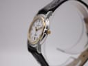 Right side profile of the Michel Herbelin watch, showing the gold-tone crown and two-tone case.