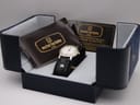 Michel Herbelin watch in an open Maurice Lacroix box with Michel Herbelin papers.