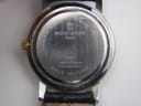 Close-up of the stainless steel case back of the Michel Herbelin watch, showing model number and 'made in France ETA swiss movt'.