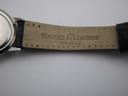 Underside of the black leather strap, showing 'Maurice Lacroix Switzerland' branding.
