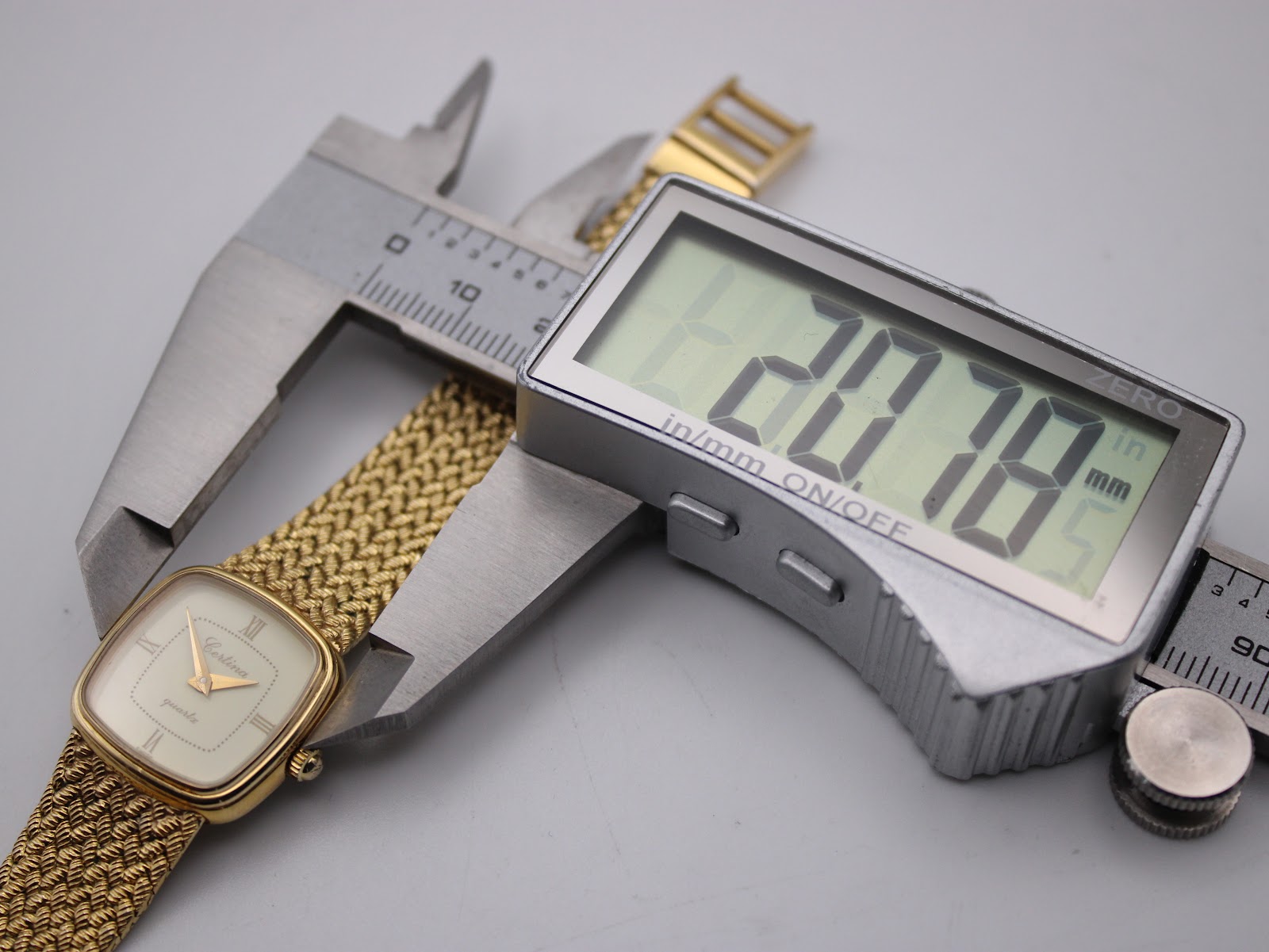 A digital caliper measuring the case width of the Certina watch, displaying a measurement of 20.78mm.
