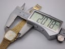 A digital caliper measuring the case width of the Certina watch, displaying a measurement of 20.78mm.