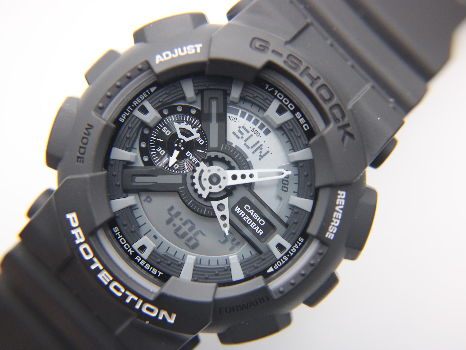 Detailed close-up of the Casio G-Shock GA-110C ana-digi dial, showing the hands, sub-dials, and digital time display.