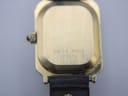 Close-up of the watch case back, engraved with 'Swiss Made' and the model number '71570'.