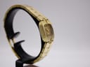 Side-angled view of the Rotary watch on a display stand, focusing on the slender case profile and the texture of the bracelet links.