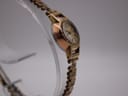 Another side profile view of the Rotary watch, highlighting the decorative bezel.