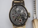 Macro shot of the manual wind Swiss movement with the case back removed.