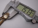 Digital caliper measuring the watch case diameter at 19.13mm.