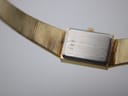 Close-up of the watch case back, clearly showing the engraved serial number '1991'.