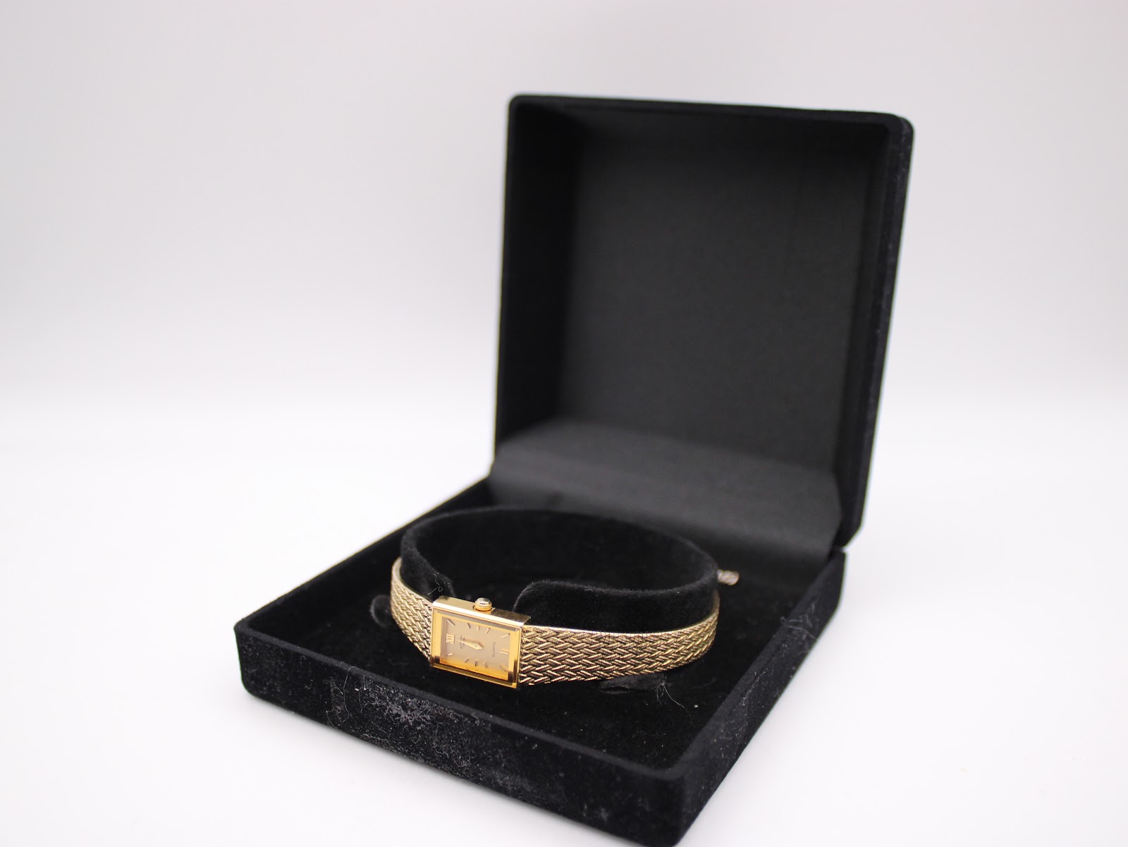 The Rotary watch presented inside a black velvet display box, demonstrating its elegant presentation.