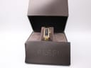 Front view of Gucci 1500L watch in its original brown box, partially open on a white background.