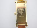 Close-up of the watch case back, showing 'GUCCI' crest and '1500L' model engraving with some surface scratches.