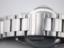 Close-up of the exterior of the stainless steel bracelet clasp, showing the 'GUCCI' engraving on one of the links.