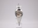 Front view of the Gucci 103 watch, showing the oval silver case and cream floral dial, on a transparent stand.
