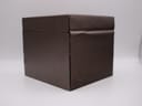 Side view of the closed brown Gucci presentation box, showing its textured finish.