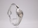 Angled side view of the Gucci 103 watch with its integrated silver bracelet, showcasing the oval shape.