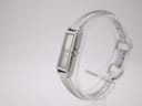 Angled side view of the Gucci 109 watch, showcasing the crown and integrated bracelet design.