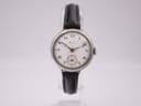Front view of the Longines vintage manual wind watch, featuring a white dial with arabic numerals and a sub-seconds display, on a black leather strap.