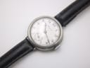 Top-down view of the Longines watch, showcasing the dial and strap on a neutral background.