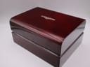 Top view of the closed original dark wooden Longines presentation box.