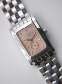 Angled close-up of the rose gold dial of the Longines 7751, showing the sub-seconds dial and applied baton indices.
