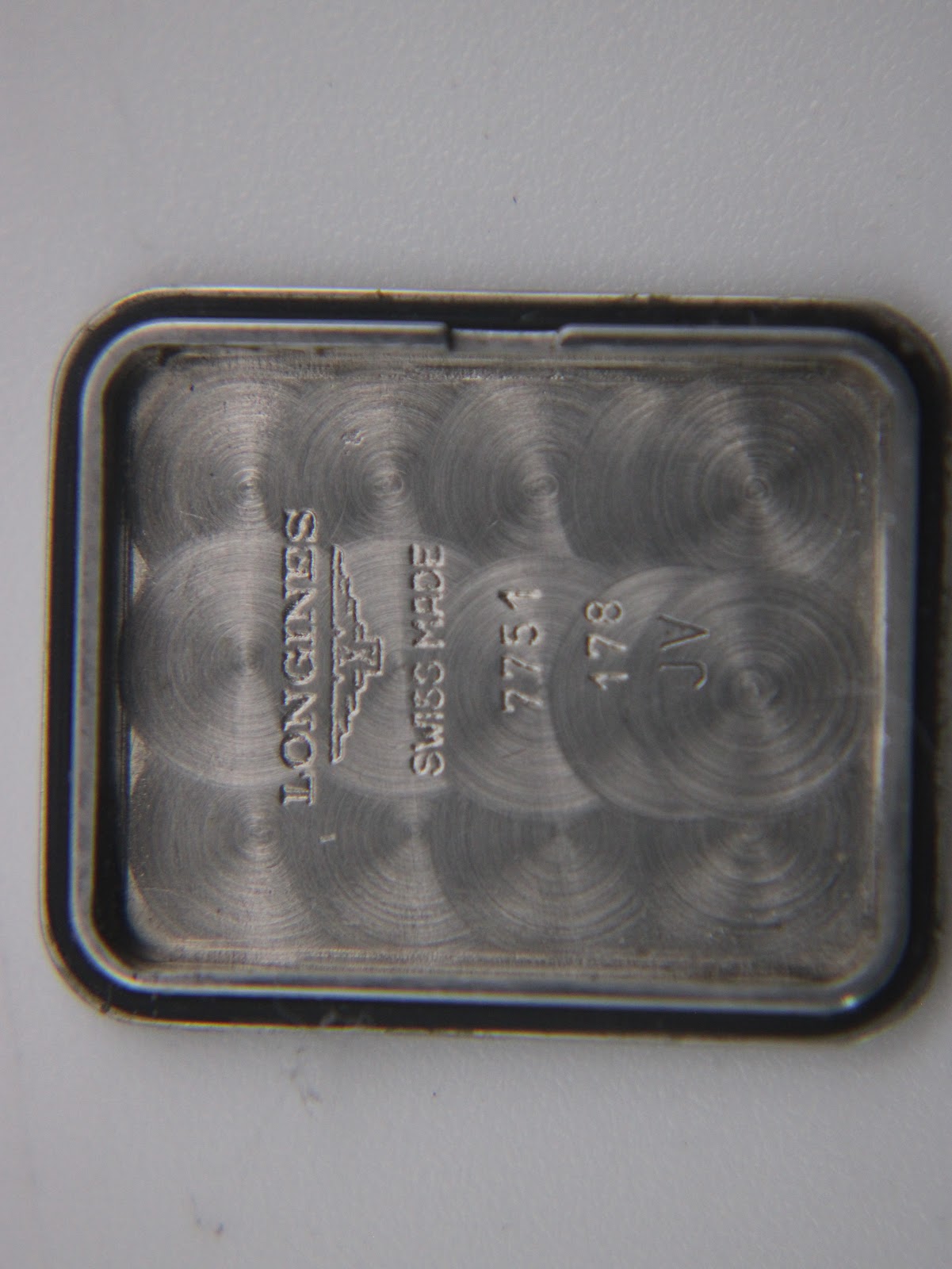 Macro close-up of the case back engraving, clearly showing "LONGINES SWISS MADE 7751 178 JV".