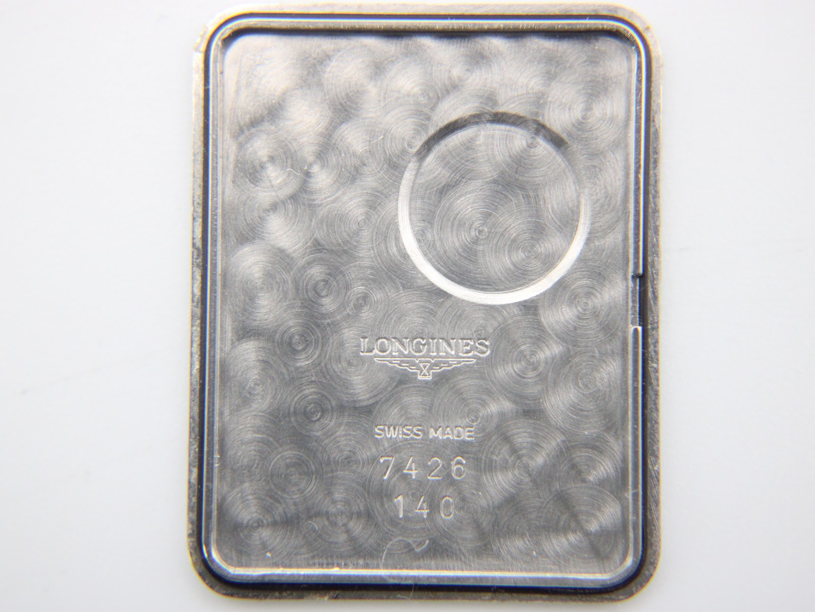 Close-up of the inner case back, showing "Longines Swiss Made 7426 140".