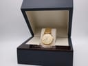 The Longines watch presented inside its original dark blue Longines box.