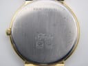 Close-up of the stainless steel case back of the Longines Flagship, revealing "Stainless Steel Back", "Flagship" engraving, and serial number 25303635.