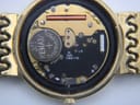 Detailed close-up of the Swiss quartz movement inside the Longines watch, with a newly fitted Renata 371 battery and "Six 6 Jewels Swiss V8" inscription.