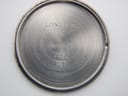 Close-up of the inside of the stainless steel case back, showing the Longines logo, "Swiss Made", and model number 7122.