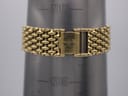 Close-up of the gold-tone bead-of-rice bracelet clasp, signed with the Longines logo, shown on a wrist sizing gauge indicating a circumference of 172mm.
