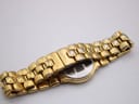Close-up of the underside of the gold-tone bracelet and signed Longines folding clasp.