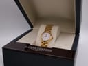 Longines Conquest watch displayed inside its dark blue original presentation box.