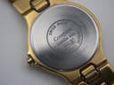Close-up of the stainless steel case back with "Swiss Made", "Conquest", serial number 25573582, and "Stainless Steel".