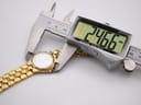 Digital caliper measuring the case diameter of the Longines Conquest watch at 24.66mm.