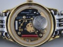 Inside view of the case back after movement removal, showing 'Longines Swiss Made' engraving and internal markings.