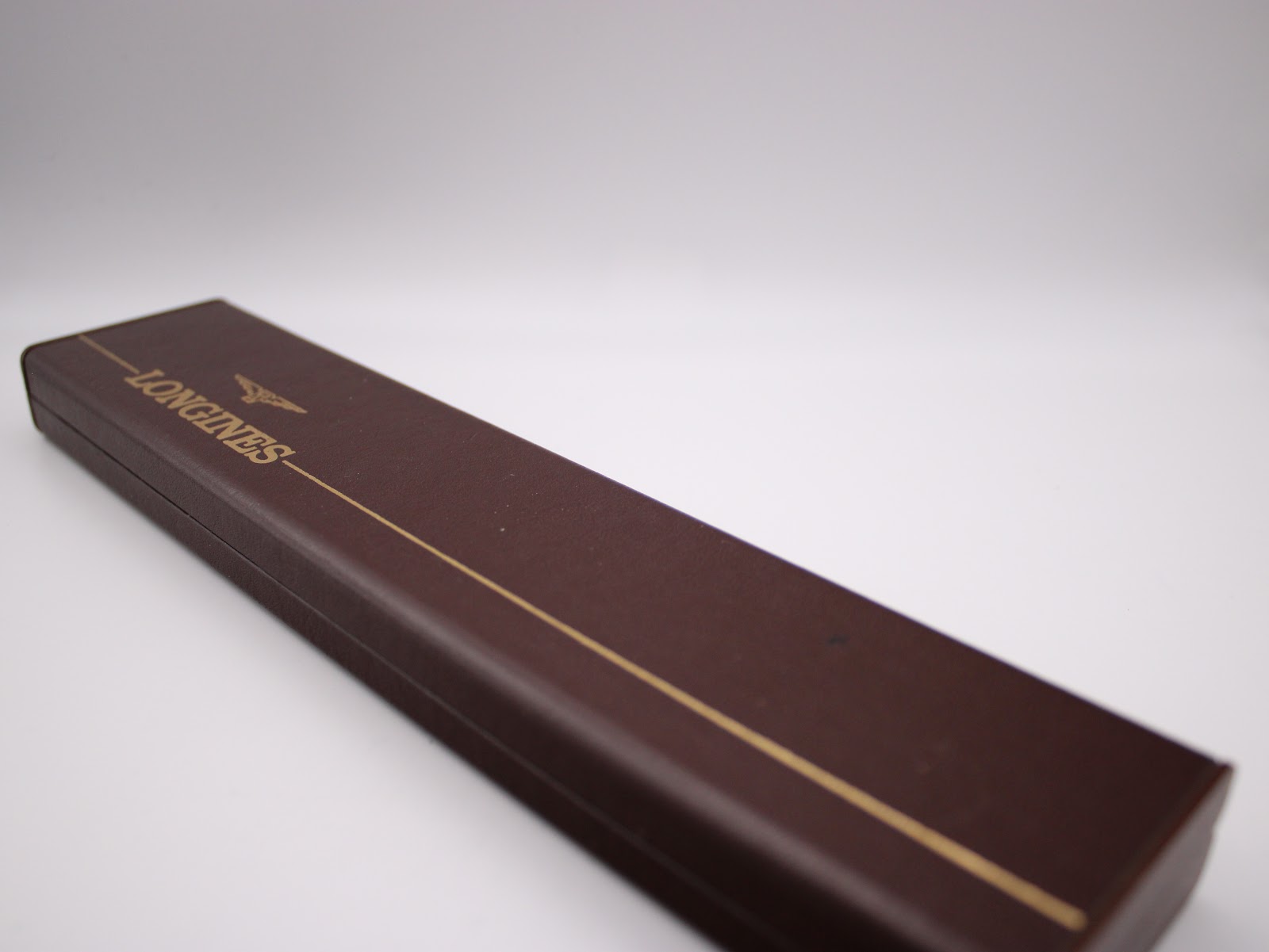 Top view of the closed original brown Longines presentation box.